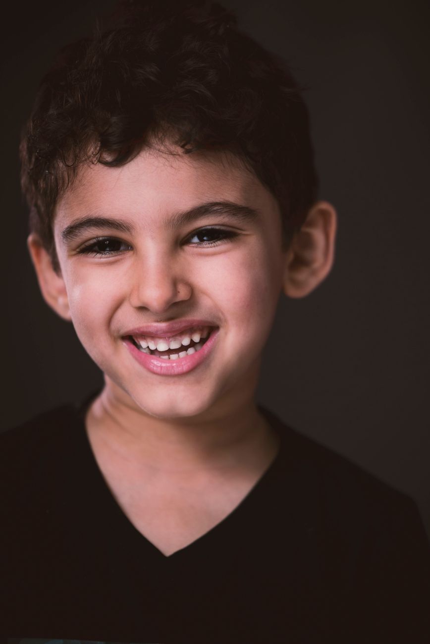 A smiling child in warm natural light